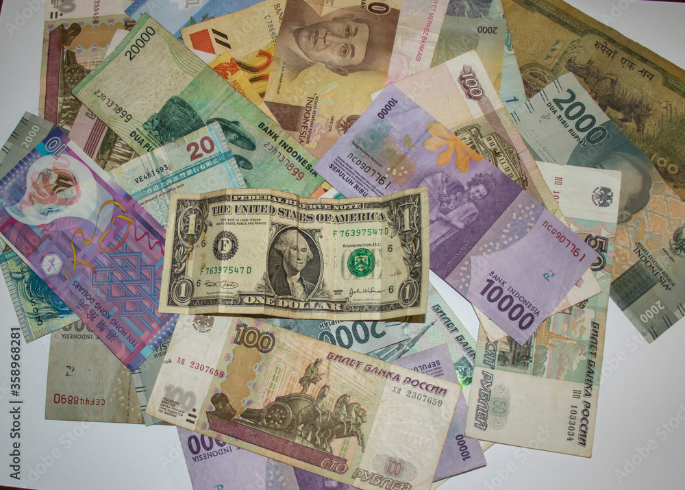 Closeup shot of different currencies. Good for presentations in finance, accounting or business development 
