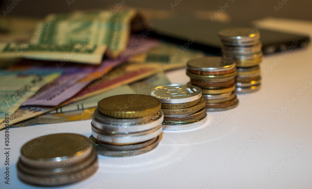 Coins and banknotes of different currencies Coins and banknotes of different currencies