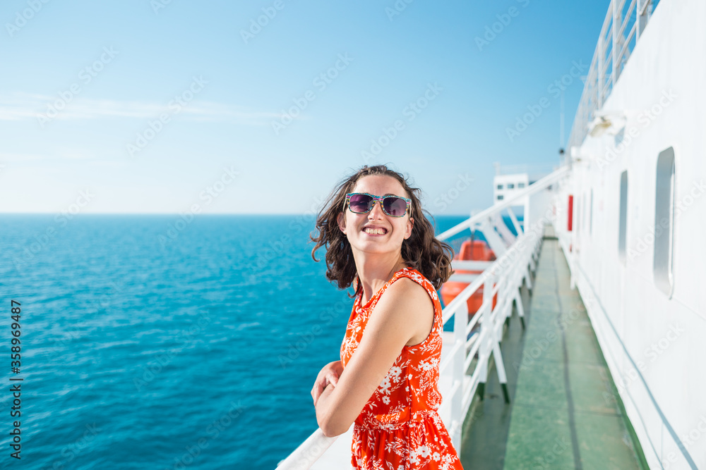 A woman is sailing on a cruise ship