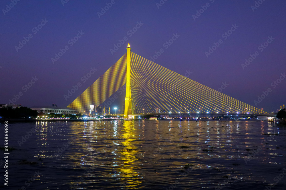 Night picture of Rama VIII bridge over Chao Praya river, Bangkok, Thailand