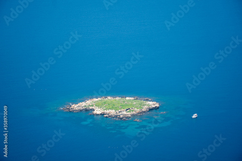 Small, lonely uninhabited island, in the midst of the endless sea © Blazej