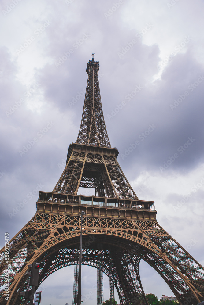 The eiffel tower on a cloudy day, in Paris, France, a low angle shot.