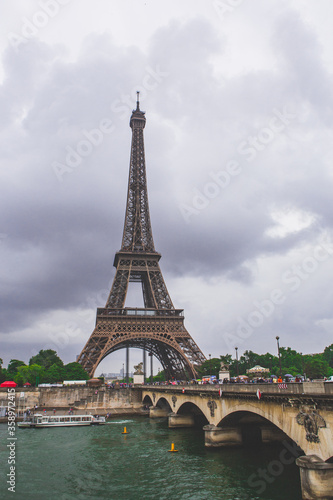 The eiffel tower on a cloudy day  in Paris  France.