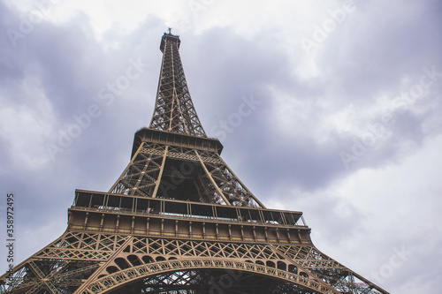 The eiffel tower on a cloudy day, in Paris, France, a low angle shot.