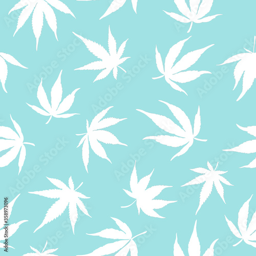 seamless pattern of cannabis leaves on a blue background. White hemp leaves. Marijuana pattern