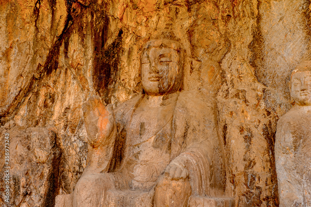 It's Buddha statue at the Longmen Grottoes ( Dragon's Gate Grottoes) or Longmen Caves.UNESCO World Heritage of tens of thousands of statues of Buddha and his disciples