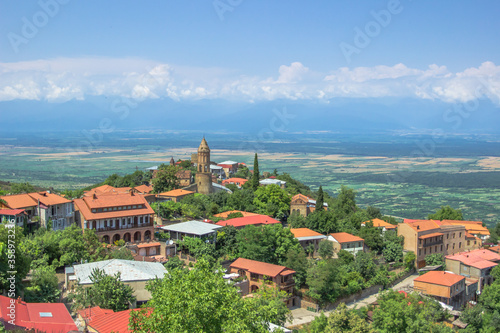 View of Signagi,town in Georgia's region of Kakheti.Popular tourist destination at the heart of wine region.Picturesque landscape,pastel houses and narrow,cobblestone streets.Alazani Valley background