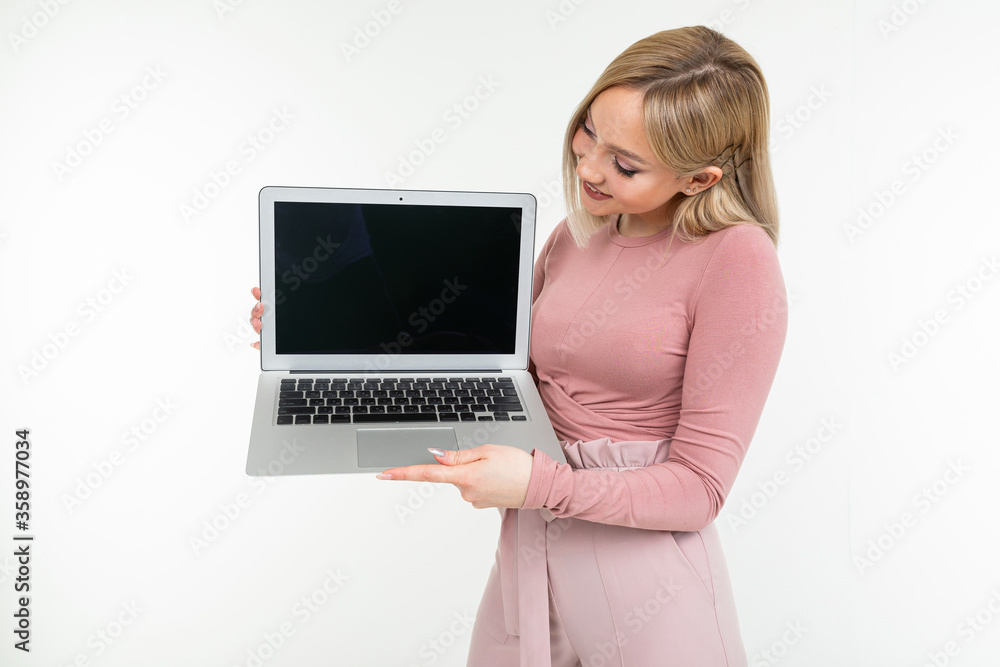 pensive stylish young woman holds laptop blank screen for website on white background pensive stylish young woman holds laptop blank screen for website on white background