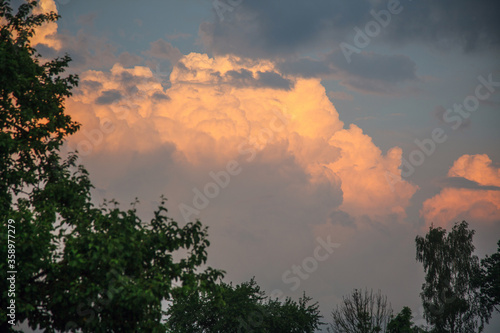 landscape with sunset and cumulus clouds