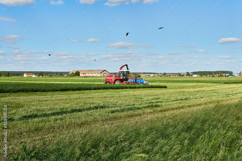 agricultural landscape with combine harvester agricultural landscape with combine harvester