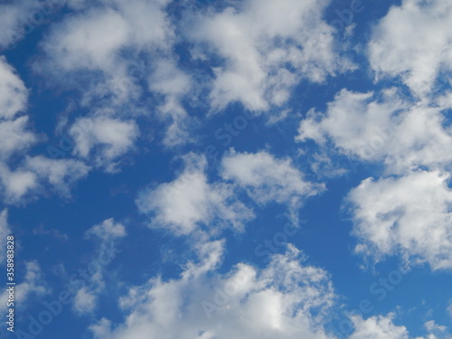 Clouds in the sky.Photo background wallpaper texture of blue sky with white fluffy clouds.Landscape of a Sunny bright day.