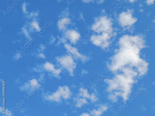 Blue sky with white clouds.Photo background wallpaper texture of blue sky with many fluffy clouds.Landscape of a Sunny bright day.