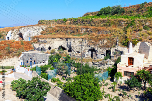 Old derelict cave houses in the village of  Vothanos in central Santorini, Greece. photo