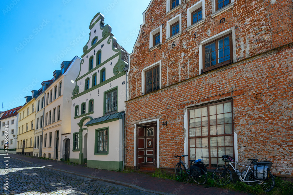 Historical house facades against the blue sky in the old town of Wismar on the Baltic Sea, Germany