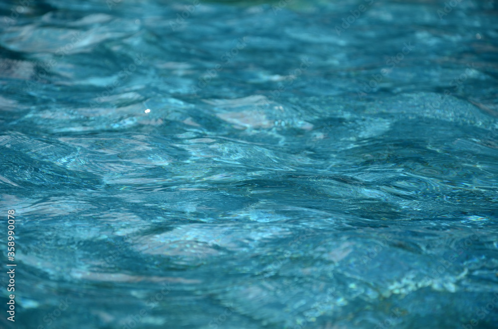 Fototapeta premium Clear and transparent water in the pool, water texture background.