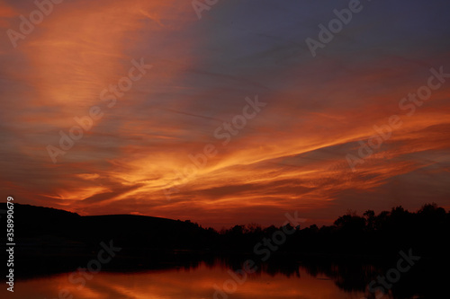 Red sunset over the lake © Ovidiu