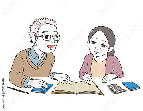 老後の計画を立てるシニア世代(青い年金手帳)