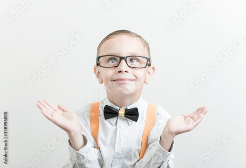 little boy writes his first school assignments