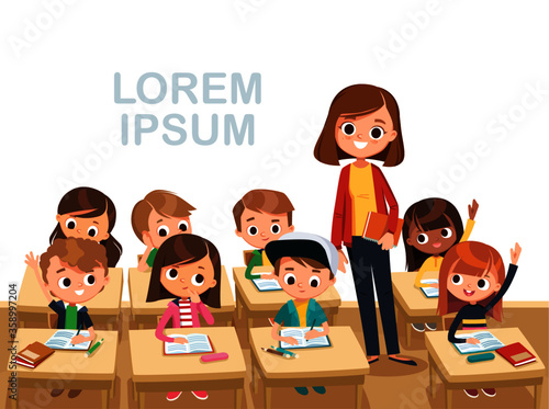 Teacher with pupils in a classroom. Primary school kids.Children listen to teacher.