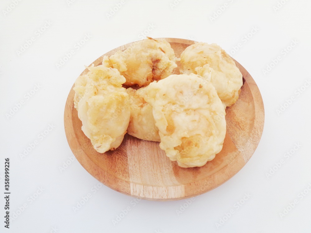 Fried fermented cassava, Indonesian famous street food or street snack. Indonesian called tape goreng, rondo royal or fried peuyeum. Sweet, creamy, crunchy outside, little oily and delicious. Fried fermented cassava, Indonesian famous street food or street snack. Indonesian called tape goreng, rondo royal or fried peuyeum. Sweet, creamy, crunchy outside, little oily and delicious.