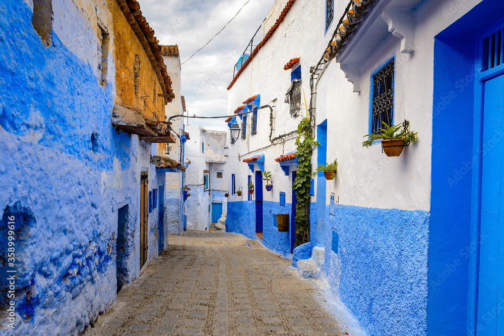 It's Blue walls street of Chefchaouen, Morocco. It's Blue walls street of Chefchaouen, Morocco.