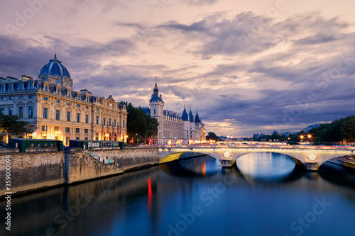 View on the Conciergerie and the seine river banks at sunset in Paris  France