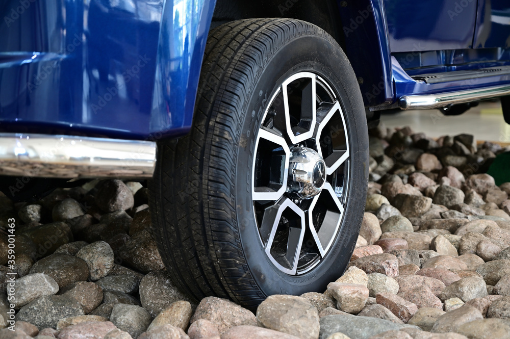 Photo on gravel stones wheels SUV car. Photo on gravel stones wheels SUV car.