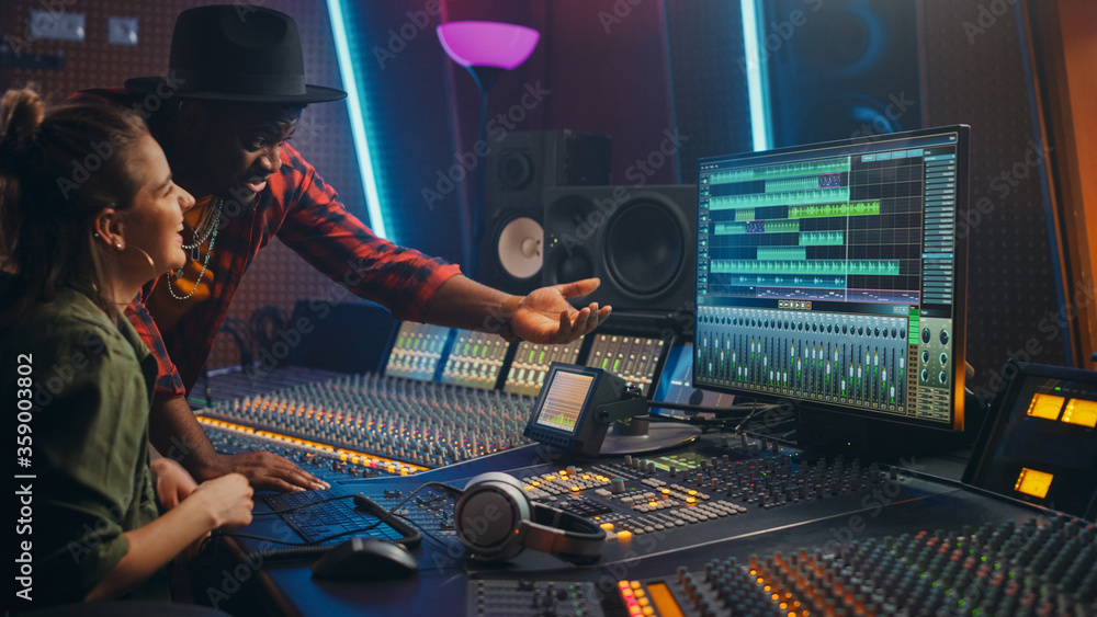 Stylish Audio Producer Working In Music Record Studio Uses Green Screen Pc  Mixer Board Equalizer And Control Desk To Create New Hit Track And Song  Creative Black Artist Musician Side View Portrait
