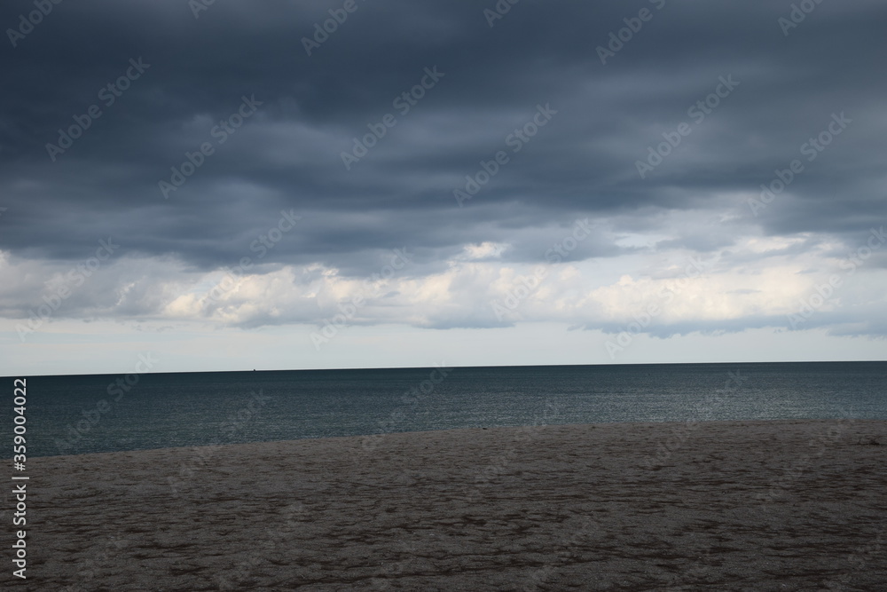 Obraz premium Rain clouds in the sea while a rain storm is coming.