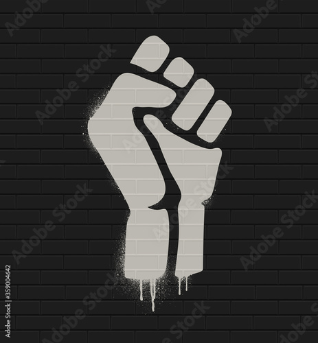 Fist raised in protest. Fist icon isolated on a brick wall. Vector illustration EPS10