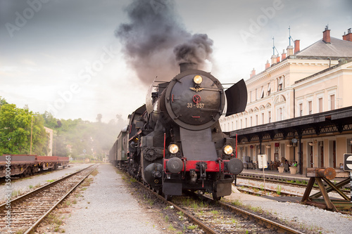 Old steam train - locomotive leaves the Nova Gorica railway station photo
