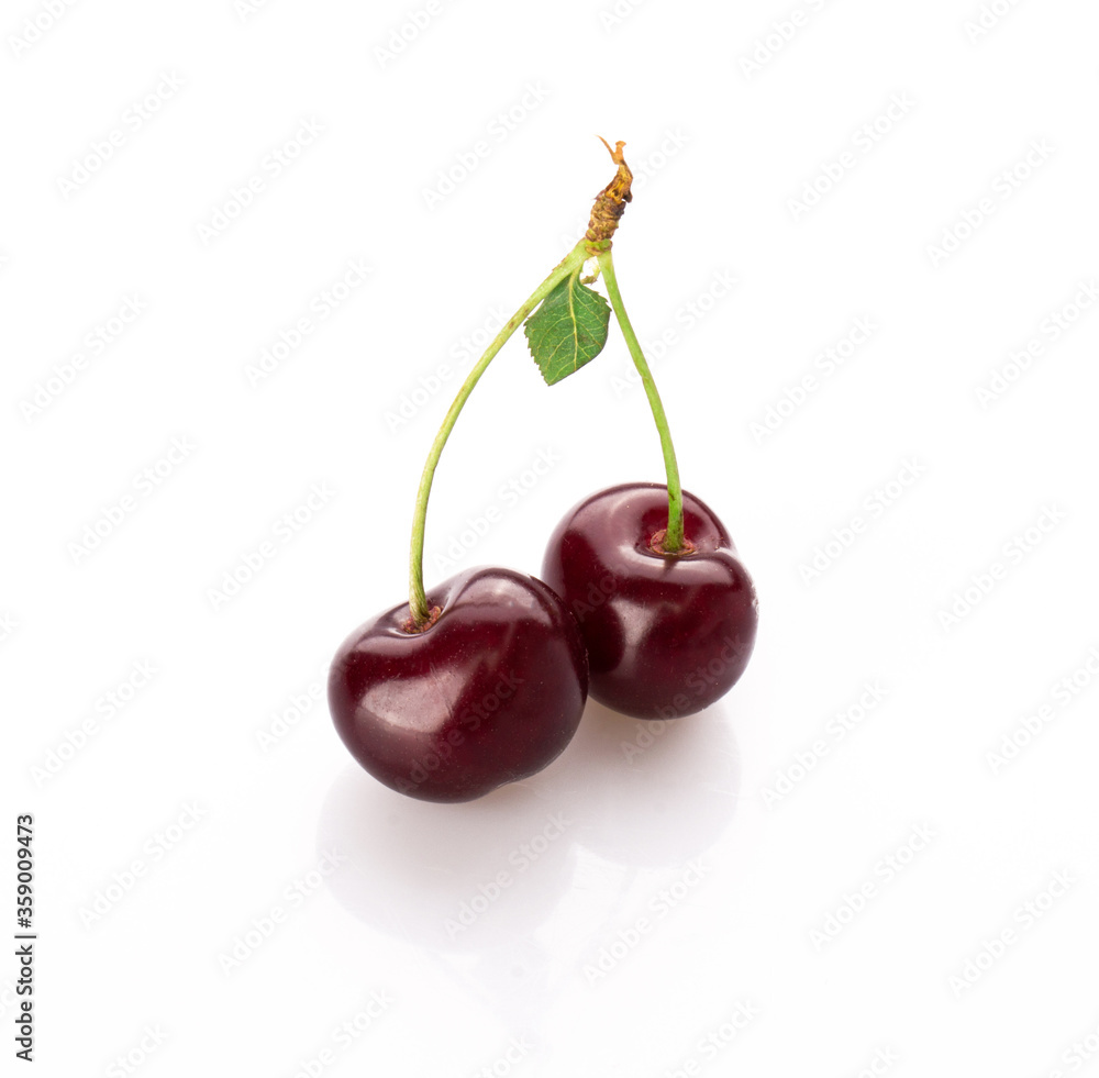 fresh cherry berries with a green leaf isolated on a white background fresh cherry berries with a green leaf isolated on a white background