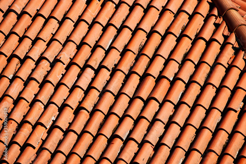  Roof of a house in Bologna, Italy, with traditional red tiles
