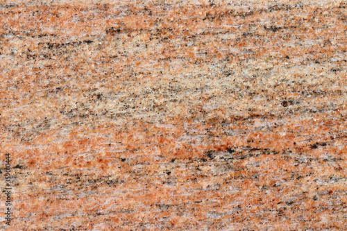 Orange spotty granite floor background.