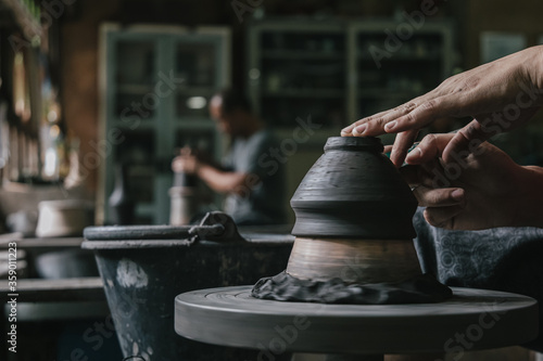 Artisan potter making art pot handicraft