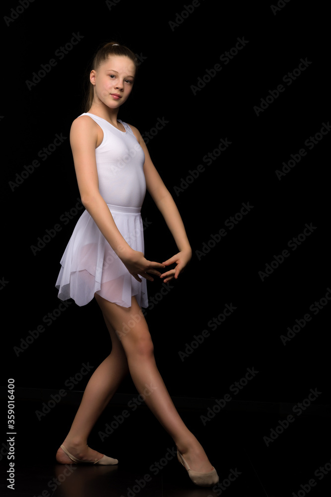 Full length portrait of a charming gymnast girl in elegant dress. Full length portrait of a charming gymnast girl in elegant dress.
