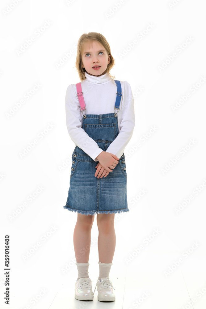 The little girl thinks.Isolated on white background. The little girl thinks.Isolated on white background.