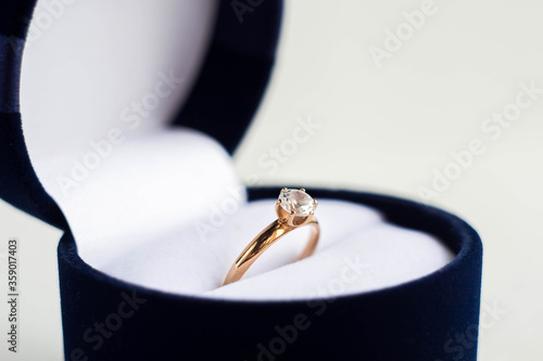 a ring with a precious stone for engagement, making an offer, showing love