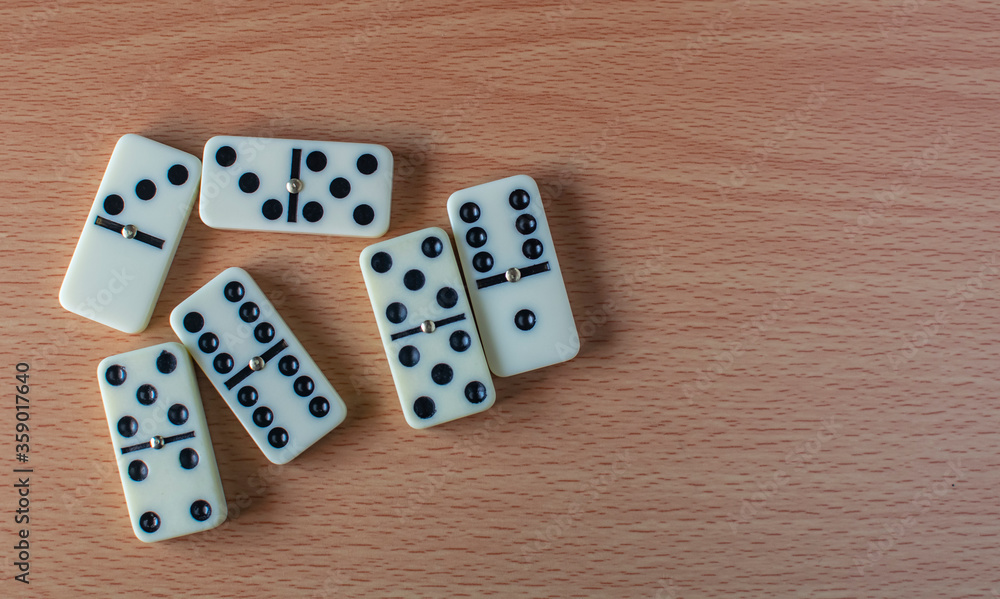 a bunch of domino blocks with numbers on a table, Selective focus, Selective focus on subject, background blur a bunch of domino blocks with numbers on a table, Selective focus, Selective focus on subject, background blur