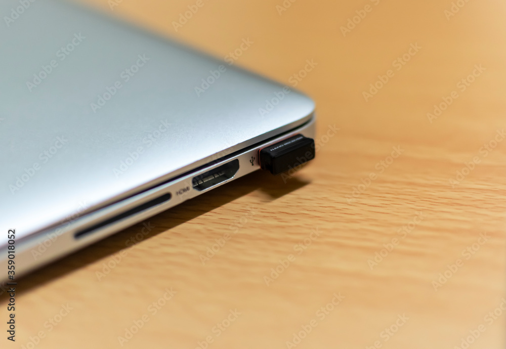 a laptop chagrging and USB ports, Selective focus, Selective focus on subject, background blur a laptop chagrging and USB ports, Selective focus, Selective focus on subject, background blur
