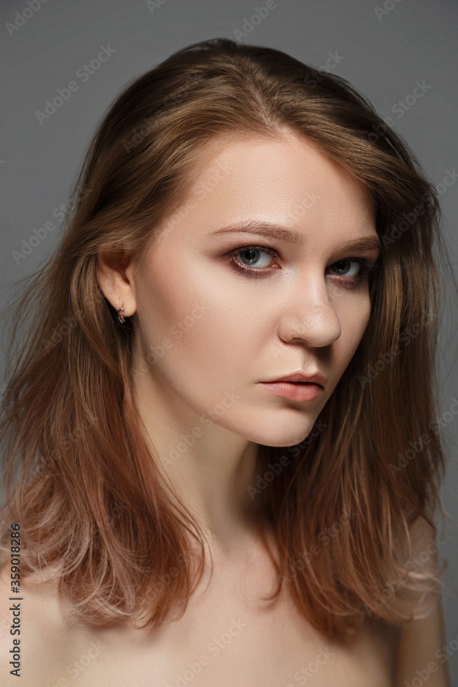 Beauty woman portrait on gray background Beauty woman portrait on gray background