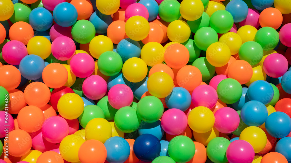 Background of colorful plastic balls in the Inflatable kids paddling pool Background of colorful plastic balls in the Inflatable kids paddling pool