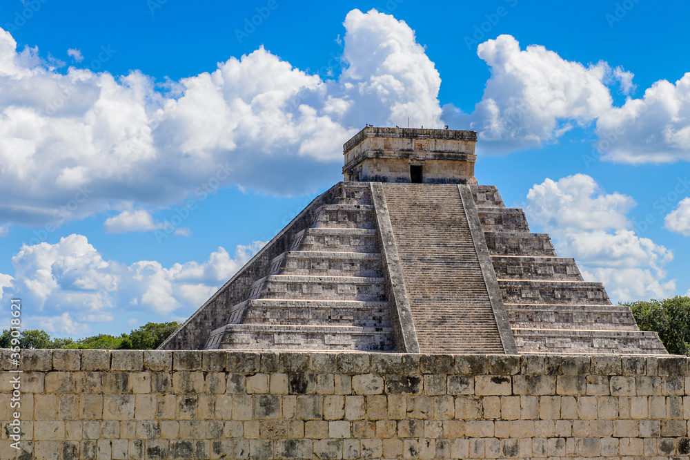 El Castillo (Temple of Kukulcan), a Mesoamerican step-pyramid, Chichen Itza. It was a large pre-Columbian city built by the Maya people of the Terminal Classic period. UNESCO World Heritage El Castillo (Temple of Kukulcan), a Mesoamerican step-pyramid, Chichen Itza. It was a large pre-Columbian city built by the Maya people of the Terminal Classic period. UNESCO World Heritage