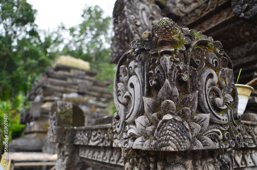 Ancient statue and carving in Hindu temple Pura Tirta Empul  Bali  Indonesia.
