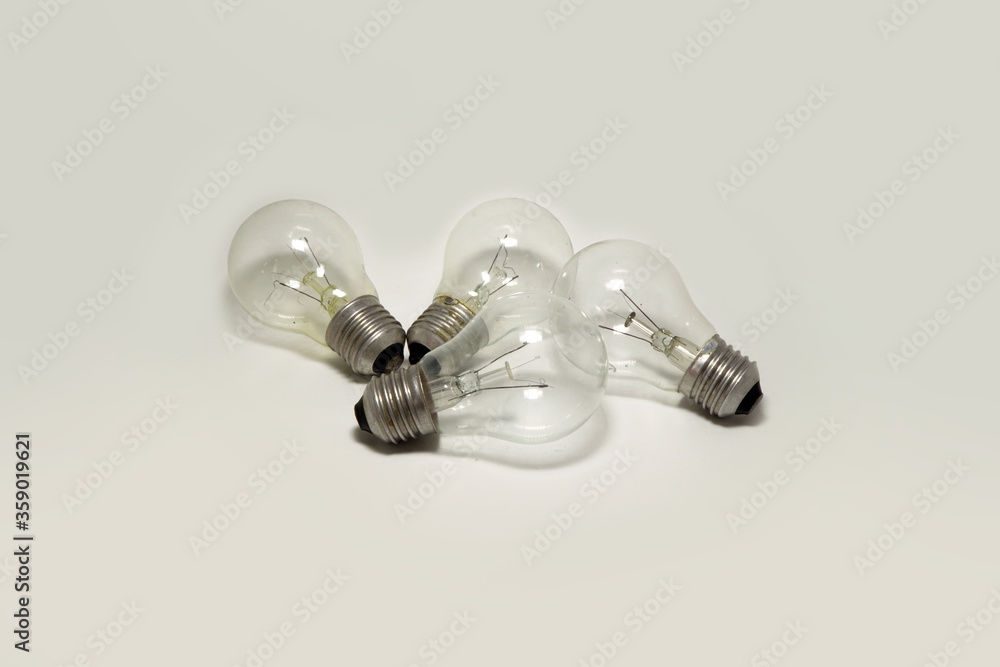 incandescent bulbs are combined on a white background. Waste incandescent bulbs incandescent bulbs are combined on a white background. Waste incandescent bulbs