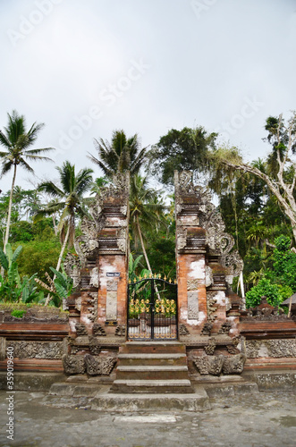 Bali temple gate - Pura Tirta Empul. Holy spring water in temple pura Tirtha Empul in Tampak, one of Bali`s most important temples, Indonesia