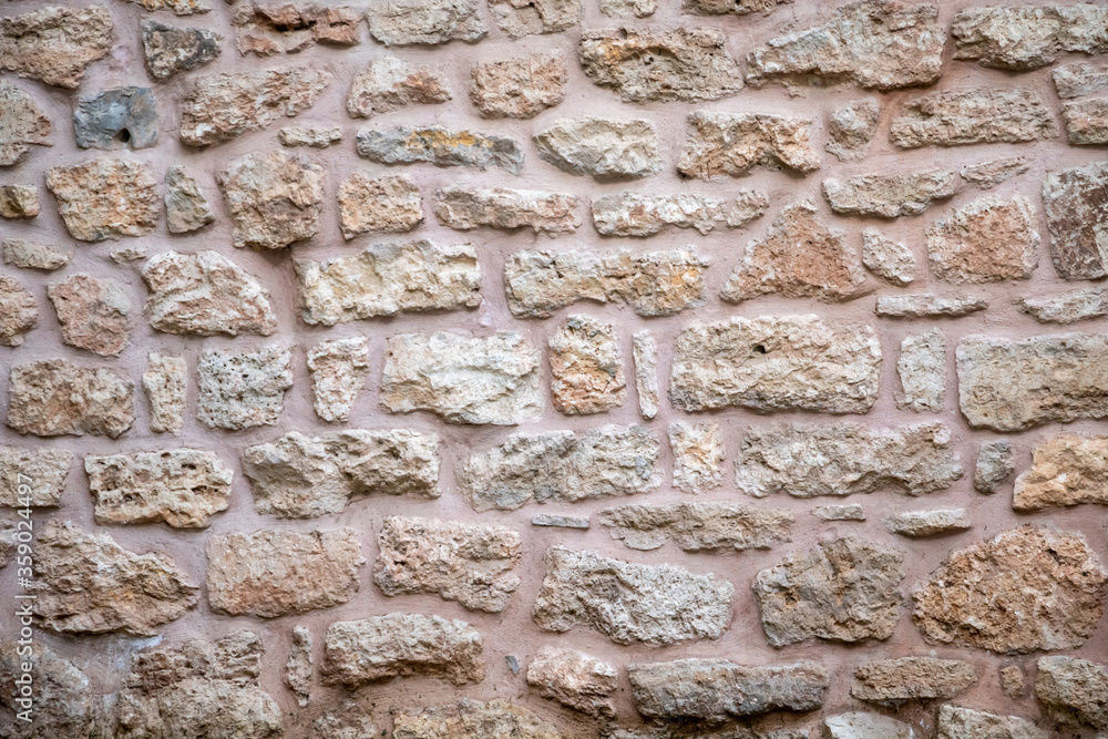 Brown, beige color, stone wall background and texture Brown, beige color, stone wall background and texture