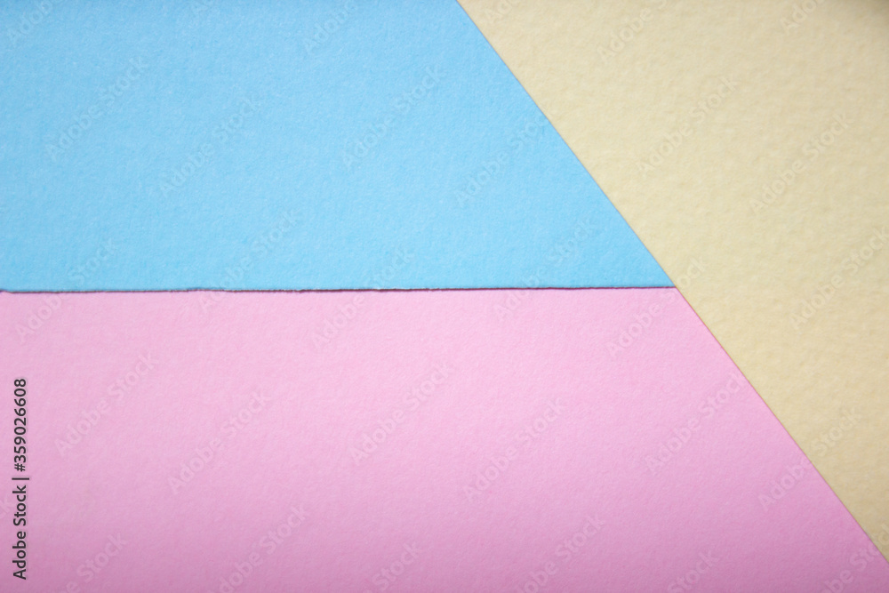 Colorful background from paper of blue, pink and cream colors. Paper abstraction of color. Colorful background from paper of blue, pink and cream colors. Paper abstraction of color.