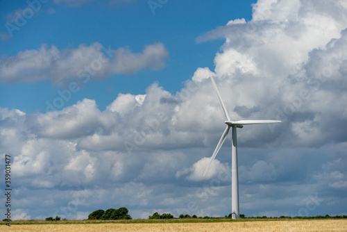 Photograph of wind turbine on a cloudy sky