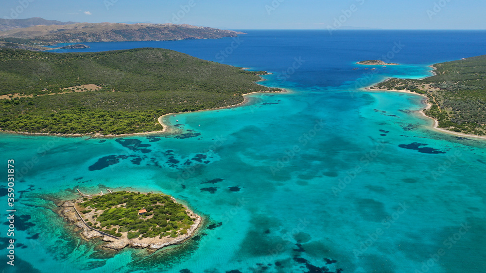 Aerial drone photo of beautiful paradise secluded island complex in gulf of of Petalioi or Petalion that form a blue lagoon with sandy turquoise beaches, South Evoia island near Marmari, Greece